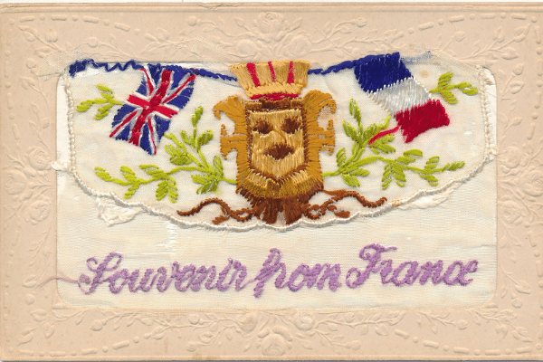 Souvenir postcard from France decorated with the Union and French flags, 1917