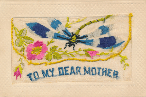 silk embroidered postcard with a dragonfly, flowers and the words "To My Dear Mum".