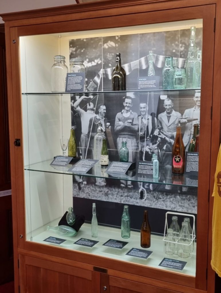 Museum display of glass bottles